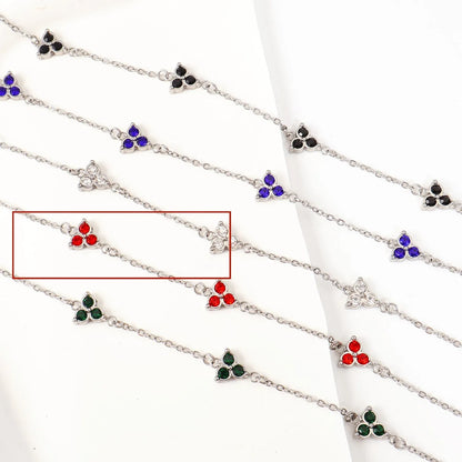 Women's stainless steel bracelet with three triangle-shaped charms in different coloured stone settings