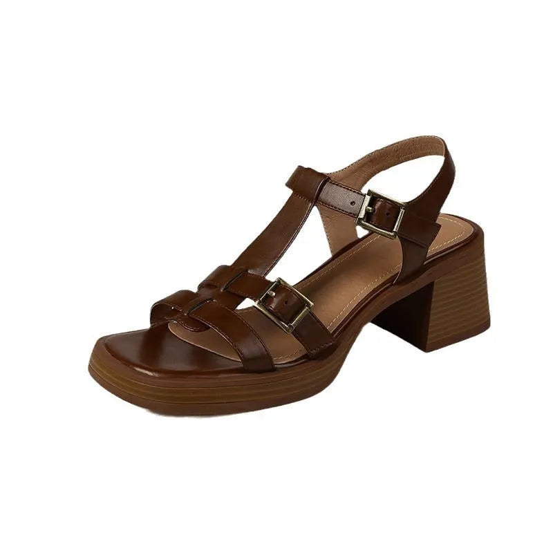 Black women's retro sandals with T-buckle, chunky heel, and open square toe.