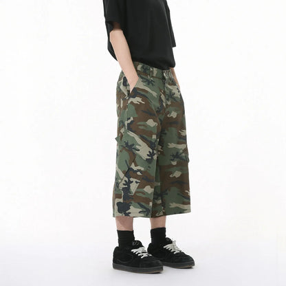 Men's camouflage pattern cotton jeans with wide-leg loose fit and cropped length, showing large side pockets