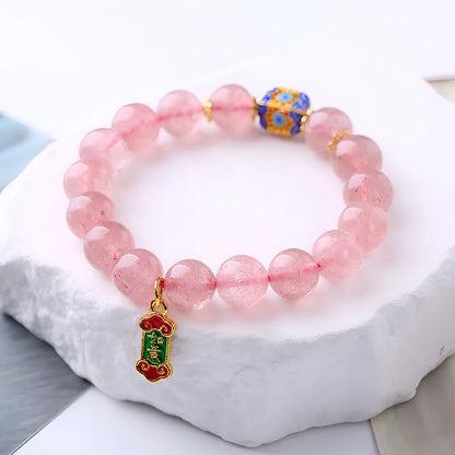 Pink strawberry quartz crystal bracelet with Ruyi charm, hand-woven in a national style.