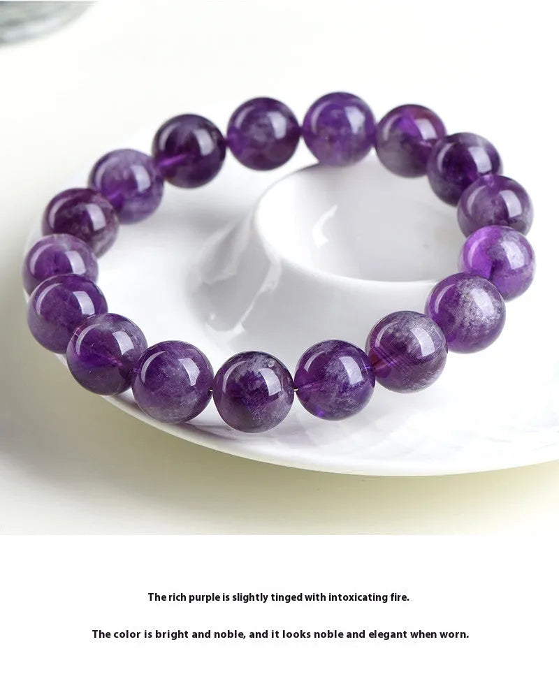 Natural feather amethyst bracelet with scattered purple crystal beads and Ruyi elements on wrist
