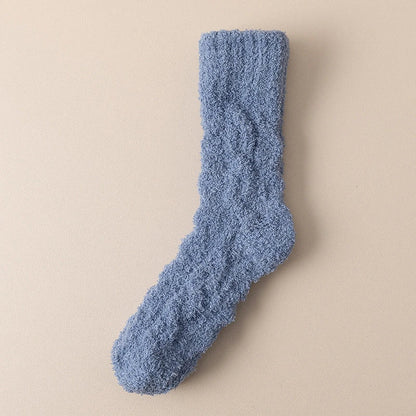 Cozy coral fleece socks in various colors, designed for superior comfort and warmth