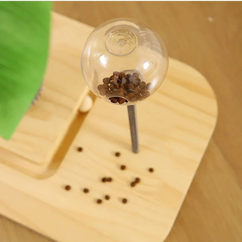 Vertical wooden cat scratching post with chamfered edges and food drop ball attachment