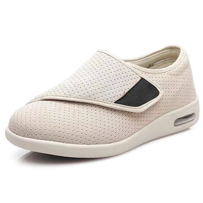 Beige leisure shoes for elderly with Velcro strap and rubber foam sole.