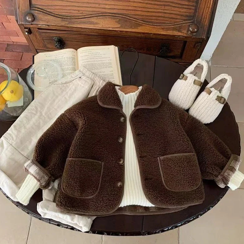 Children's beige one-piece velvet jacket with single-breasted closure showing polyester lining