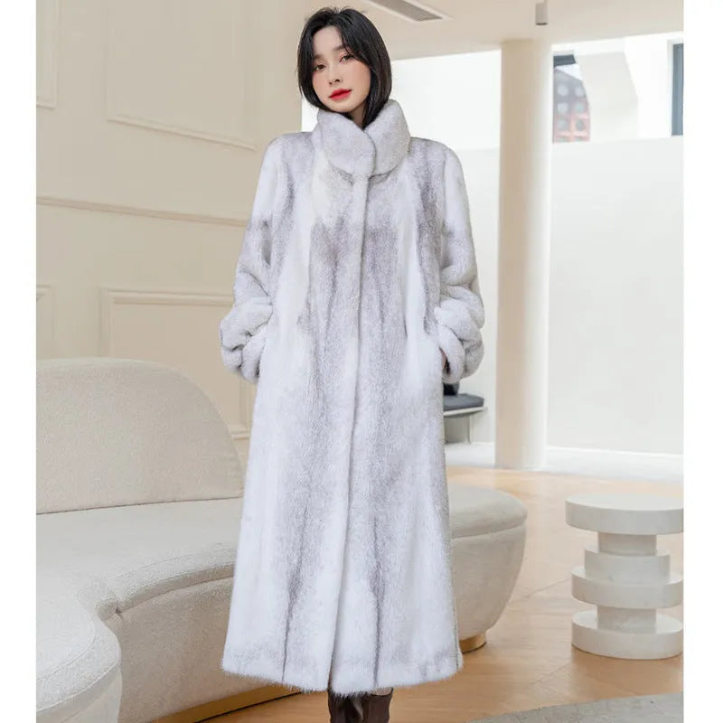 White women's faux fur coat with a stand-up collar, shown on a model.