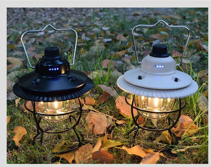 Black vintage-style iron camping lantern with USB charging and LED light, for tent and campsite use.