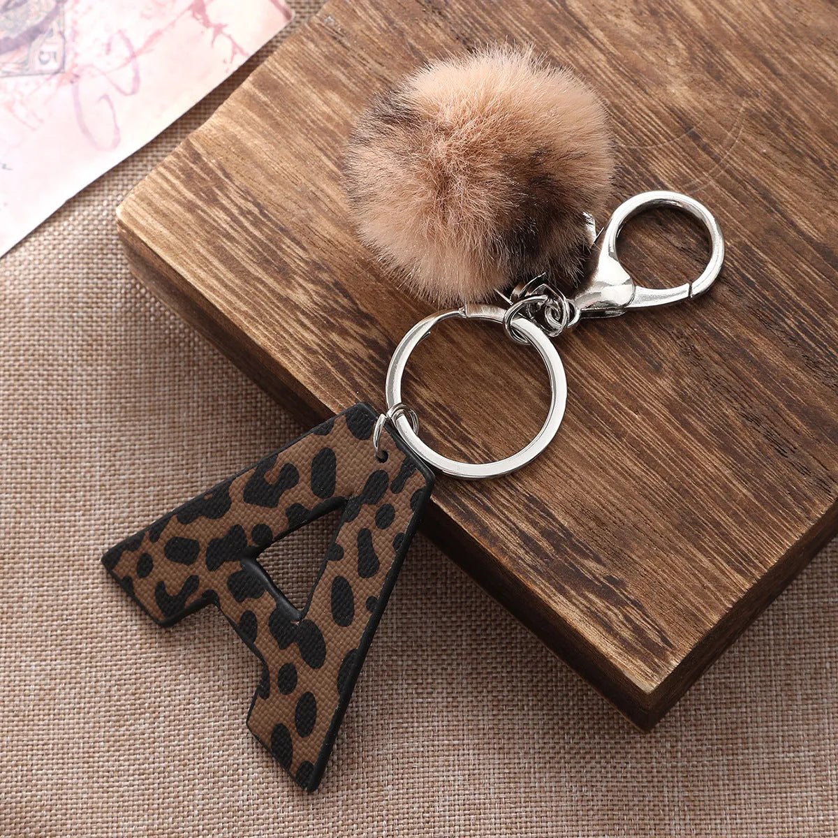 Leopard-print artificial leather keychain with oil-edged acrylic letter and included key ring, retro style