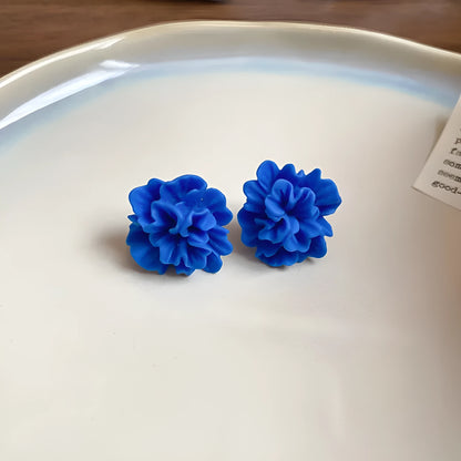 Geometric blue cloth women's earrings with round elements and a handcrafted finish.