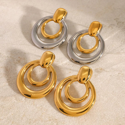 Round geometric hollow stud earrings in gold with 1.2cm diameter and centre cut-out design