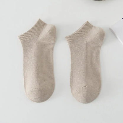 Pair of solid colour low-cut polyester boat socks for men, shown in one of six available colour options.
