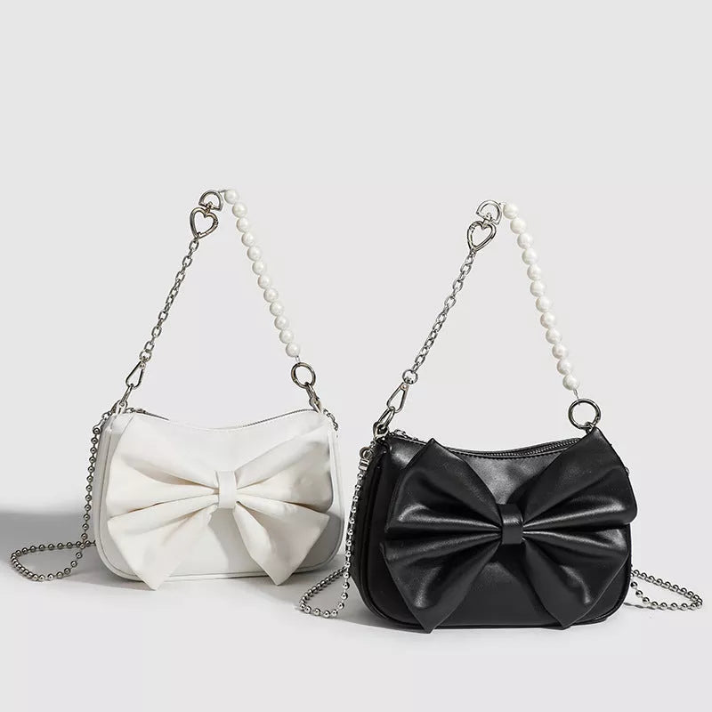 Black and white PU bow handbag with pearl chain, perfect for autumn winter fashion