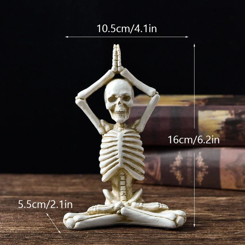 Spooky skeleton desktop decorations featuring intricate resin skulls and skeletons in vintage white and ominous black color options