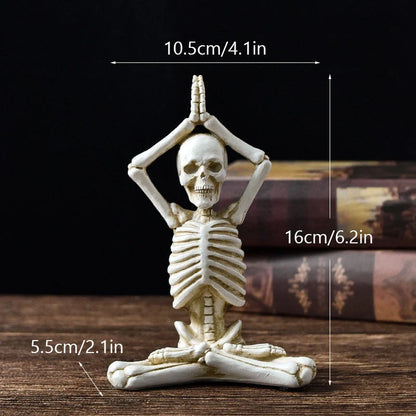Spooky skeleton desktop decorations featuring intricate resin skulls and skeletons in vintage white and ominous black color options