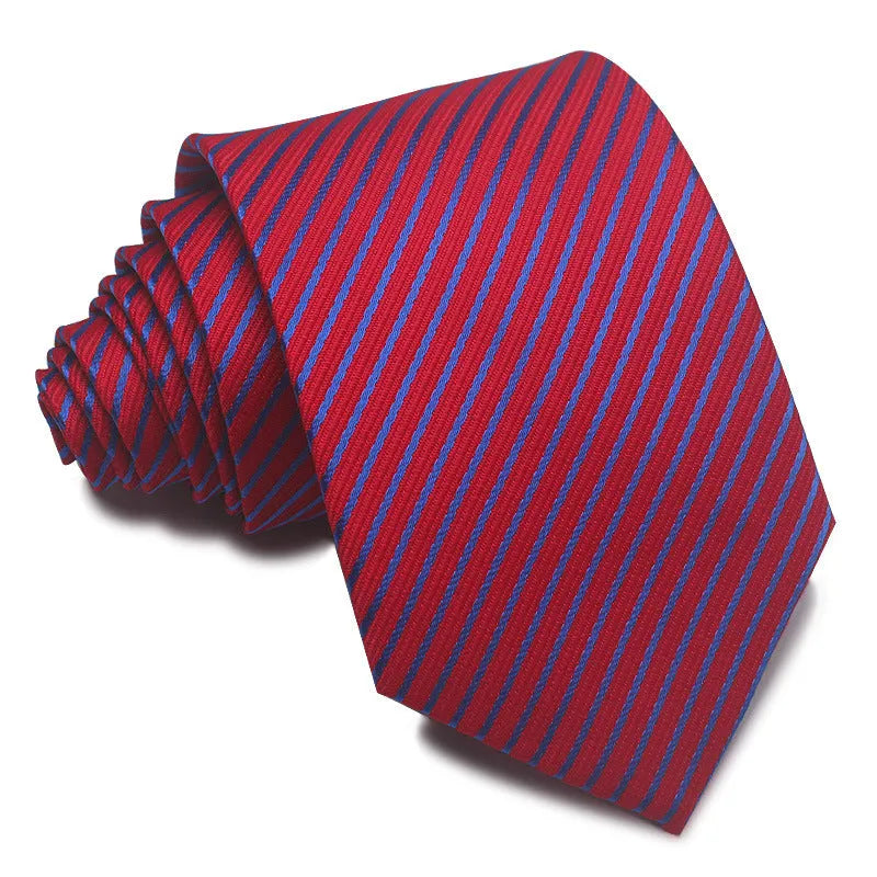 Close-up of a red and black striped jacquard weave tie with an arrow tip, showing texture.
