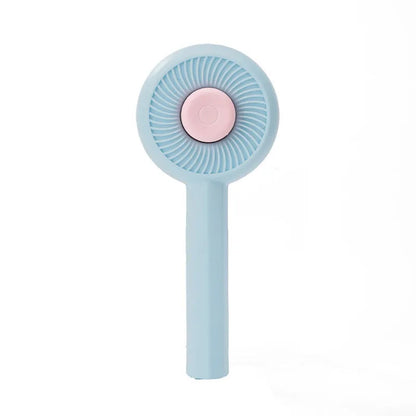Blue and yellow self-cleaning pet grooming brush with angled metal needles and a push-button on the handle.