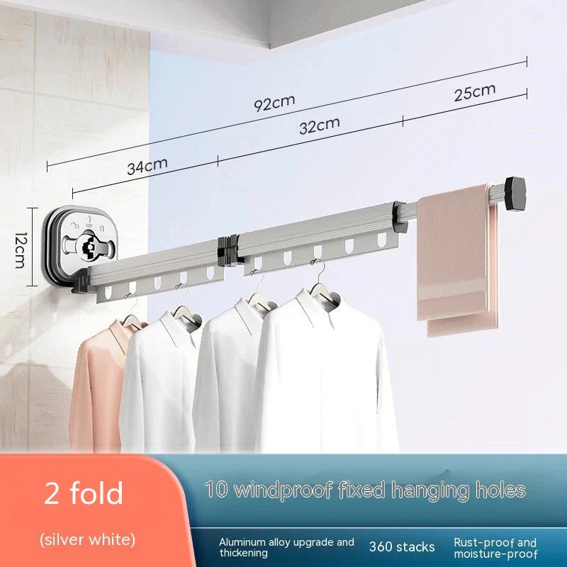 Aluminum retractable drying rack mounted on a window, extending outward for clothes drying