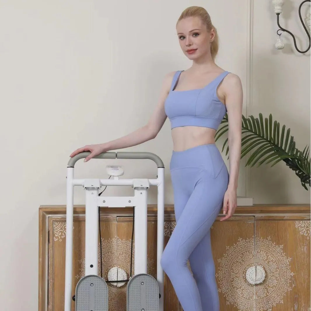 White foldable treadmill with integrated climbing frame for home fitness, showing compact storage design