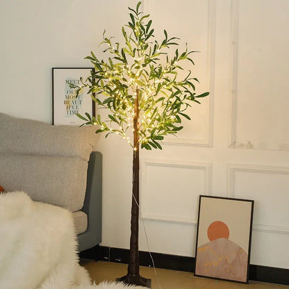 1.8 metre tall artificial olive leaf tree lamp with warm white LED lights in courtyard setting