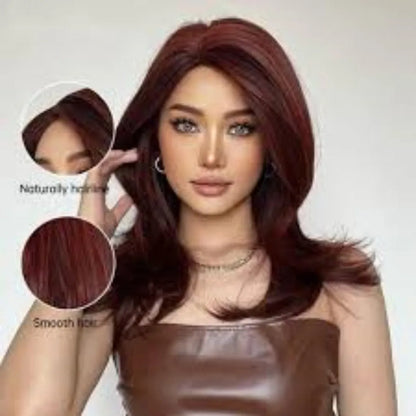 Mid-length curly synthetic wig with long bangs in a platinum gradient colour, shown on a wig stand.