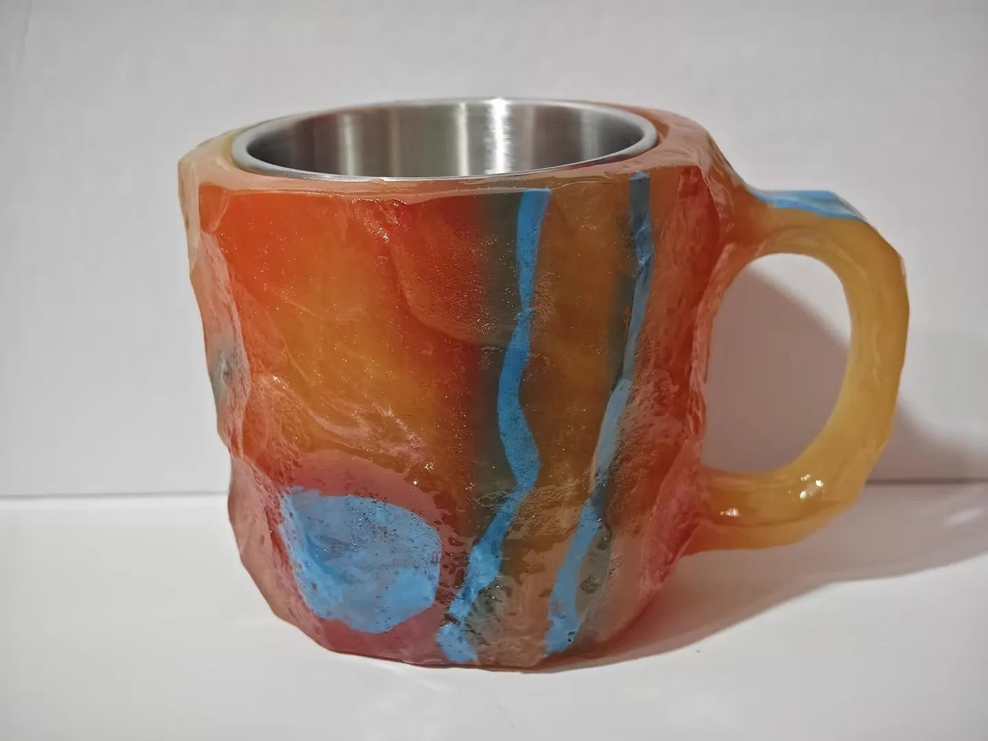 400ml resin mineral crystal coffee mug with handle in assorted colours including purple, blue, and pink.
