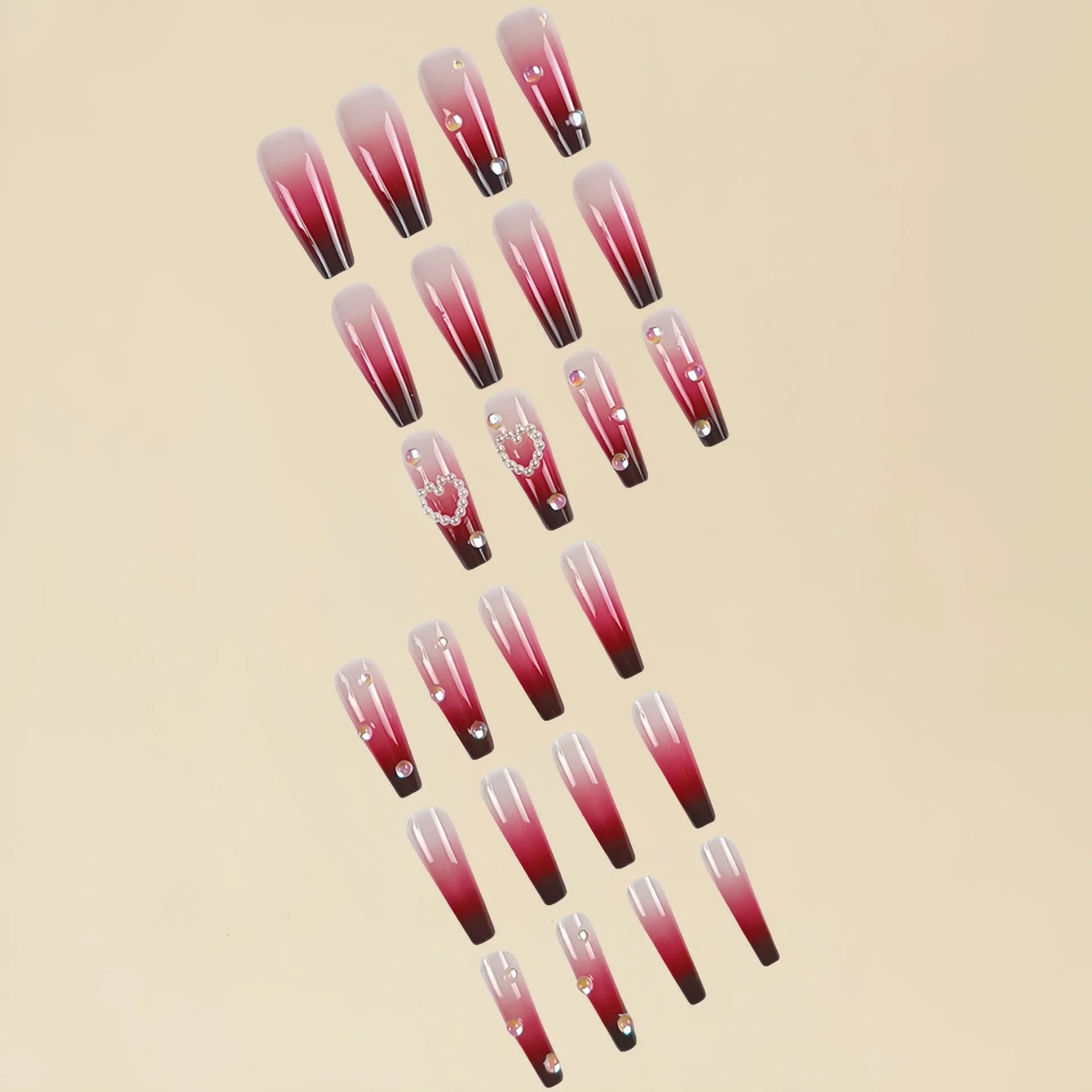 Set of long ballet-style fake nail tips with wine red gradient, white plaid pattern, and pearl heart decorations