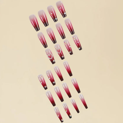 Set of long ballet-style fake nail tips with wine red gradient, white plaid pattern, and pearl heart decorations