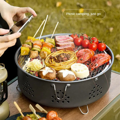 Detachable stainless steel portable barbecue grill with storage bag, shown assembled for outdoor use.