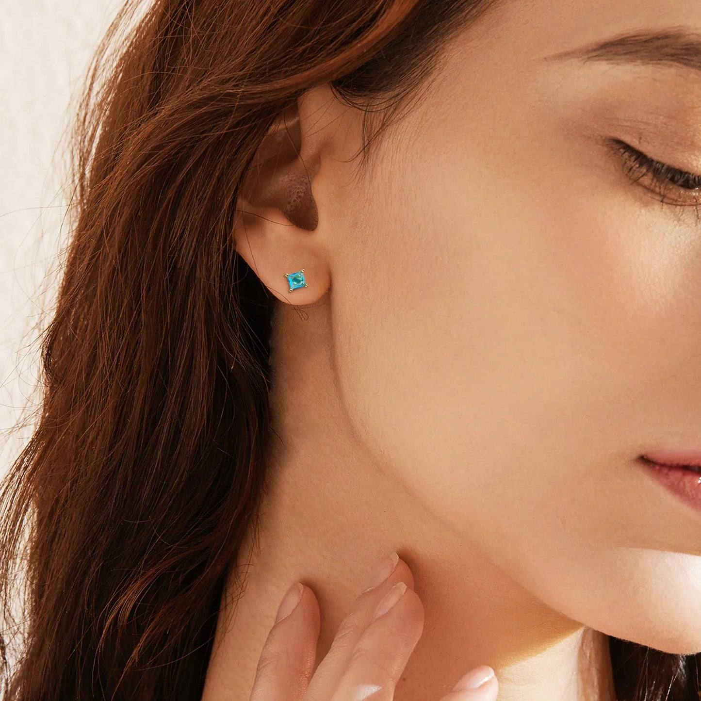 Gold-plated drop earrings with pear-shaped cubic zirconia stones measuring 0.8cm on 3.2cm copper posts