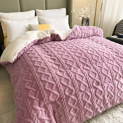 Double quilted plush quilt in sapphire blue showing detailed stitching and German velvet texture