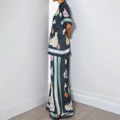 Black women's cardigan set with cartoon animation print, showing top with regular sleeves and matching trousers