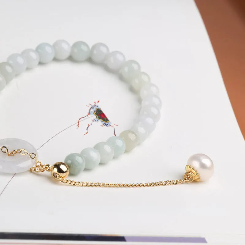 Jade pearl bracelet for women with a natural emerald peace buckle design, crafted in a geometric style with a national aesthetic, featuring a hand-finished jade pendant on a pearl bracelet in a single piece.