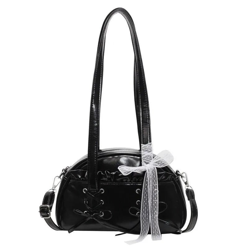 Milky white women's shoulder handbag with a large bandage bow and visible stitching, showing the internal phone pocket.
