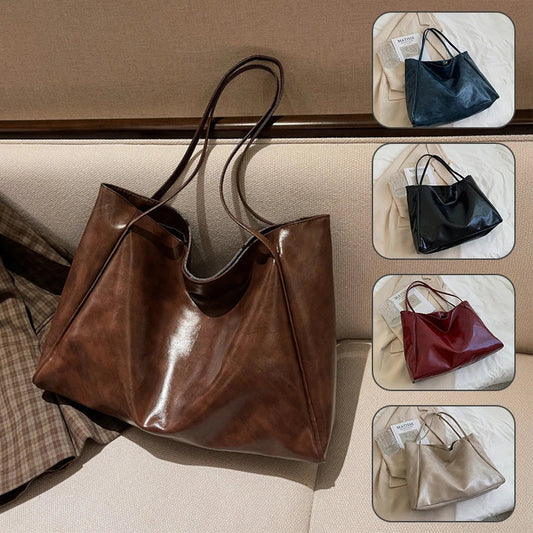 Stylish leather shoulder bag in various colors, including wine red, blue, black, brown, and beige. Showcases a versatile and spacious design for everyday use.