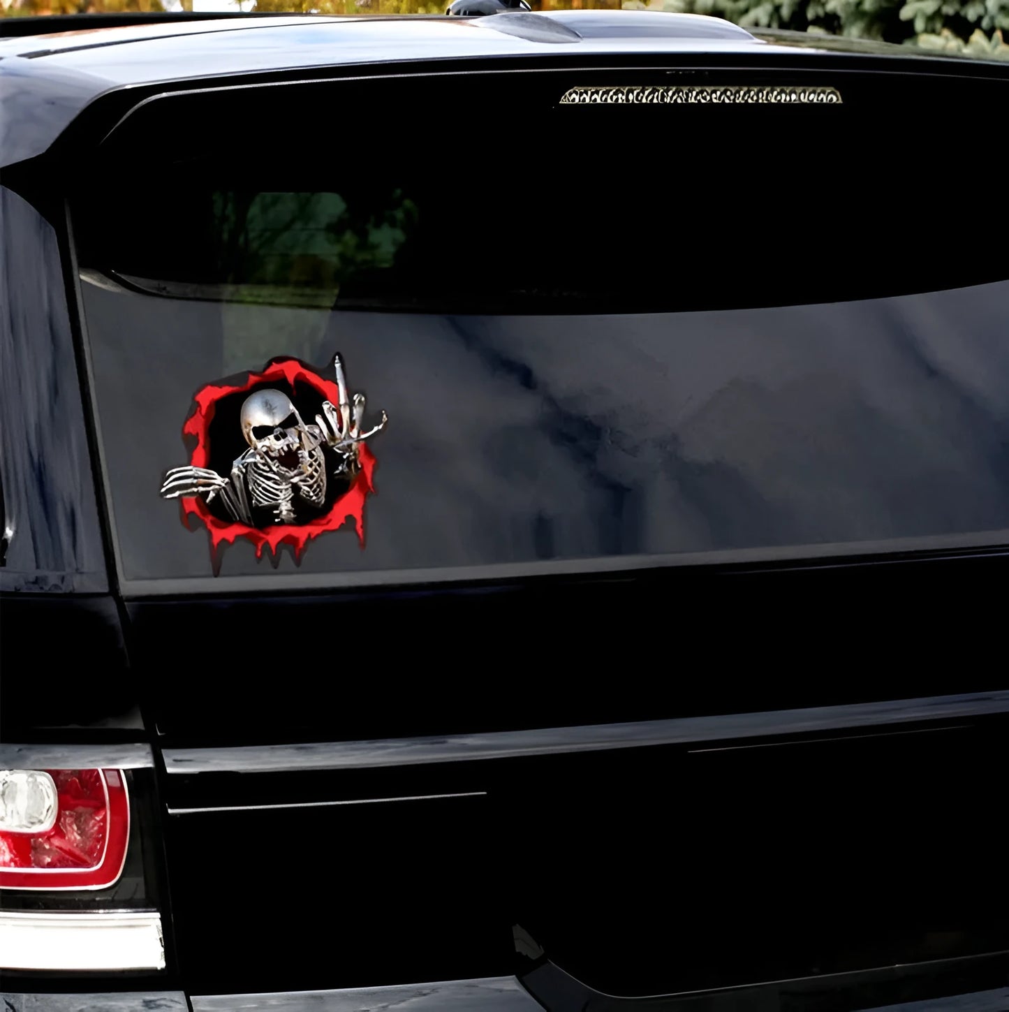 Reflective metal skull bumper sticker with colourful broken shell design on white background