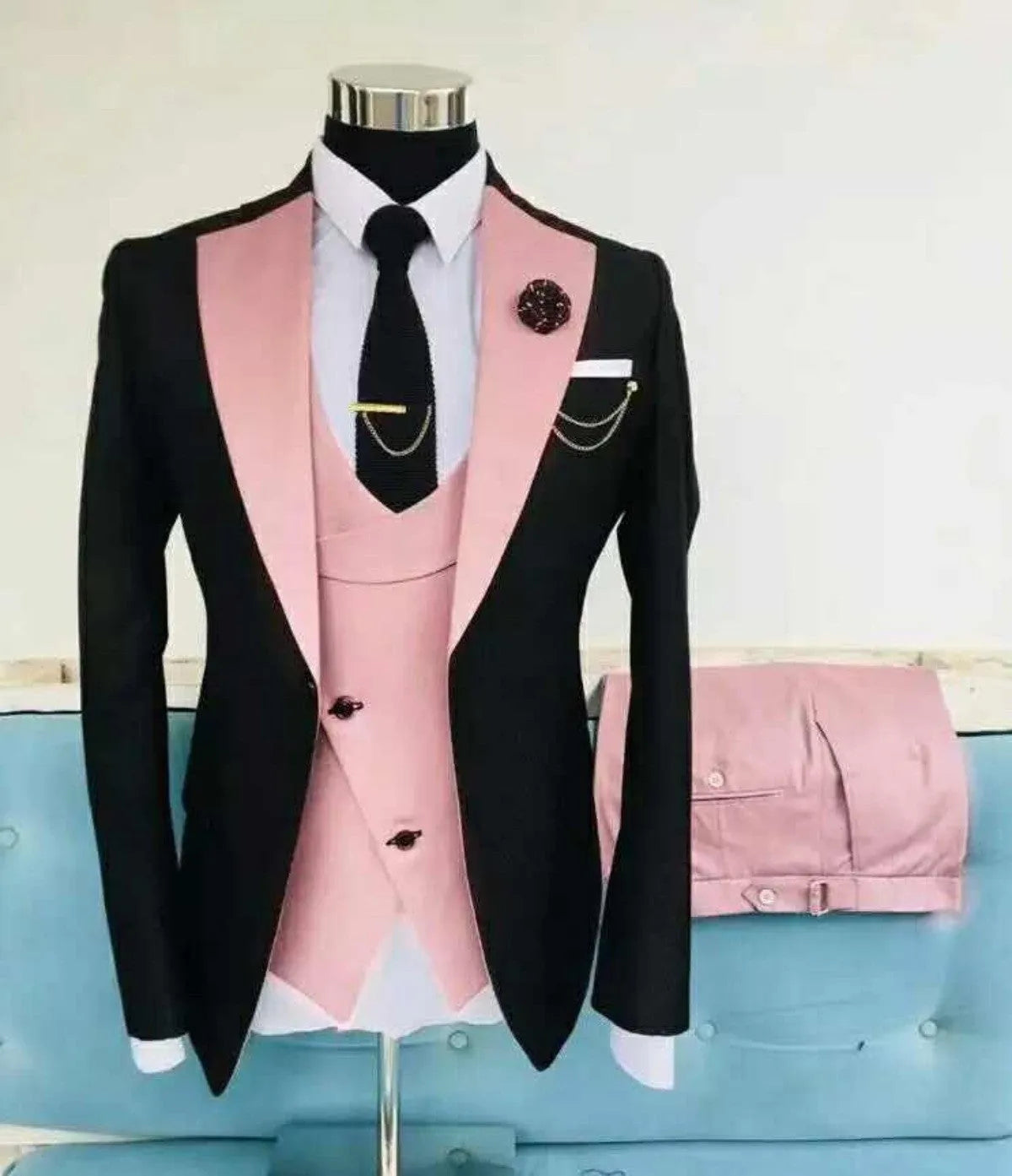 Men's slim fit three-piece business suit in black with contrasting vest, showing complete coat, vest, and trousers set