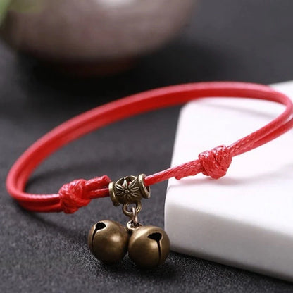 Adjustable nylon rope dog collar with brass bell in black, red, and coffee colour options