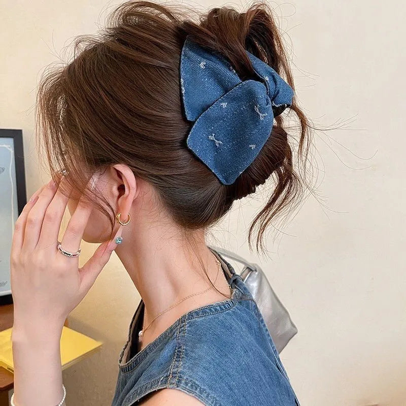 Handmade fabric bow hair grip with triangle grip design and plastic hairpin