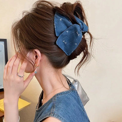 Handmade fabric bow hair grip with triangle grip design and plastic hairpin