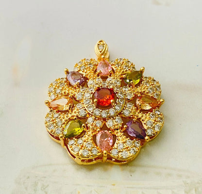 Close-up of a women's gold-coloured flower pendant necklace with a bright zircon stone centre.