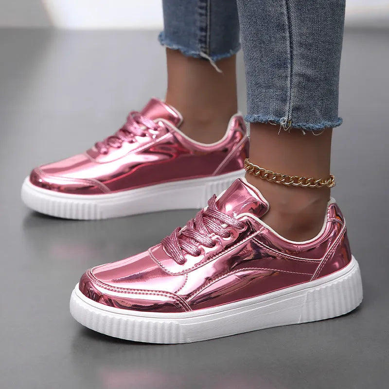 Rose gold and gold sequin platform sneakers with thick soles and round toe on a white background.