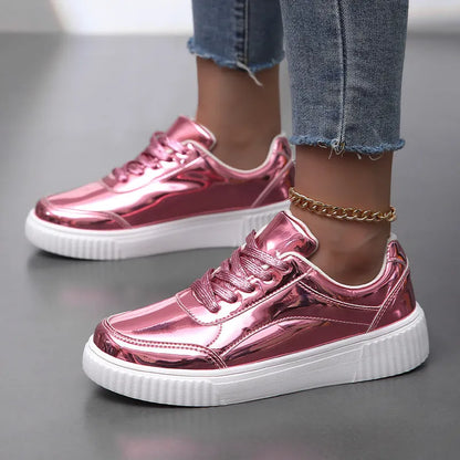Rose gold and gold sequin platform sneakers with thick soles and round toe on a white background.