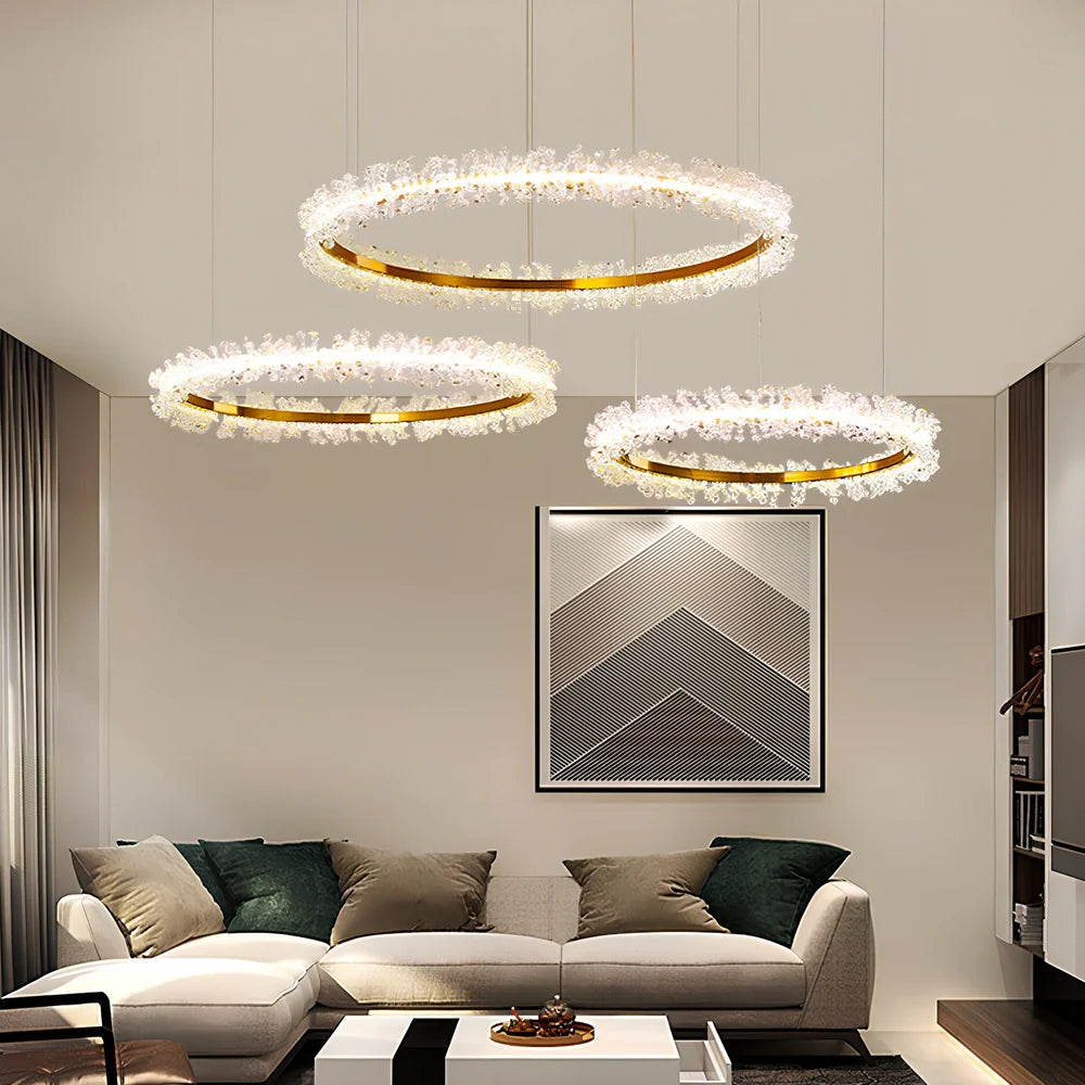 Gold electroplated crystal chandelier with remote control, adjustable height mechanism, and multiple LED lights