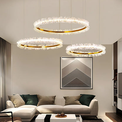 Gold electroplated crystal chandelier with remote control, adjustable height mechanism, and multiple LED lights