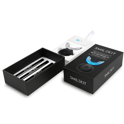 Wireless teeth whitening lamp kit in black charging suit with mint gel for portable stain cleaning