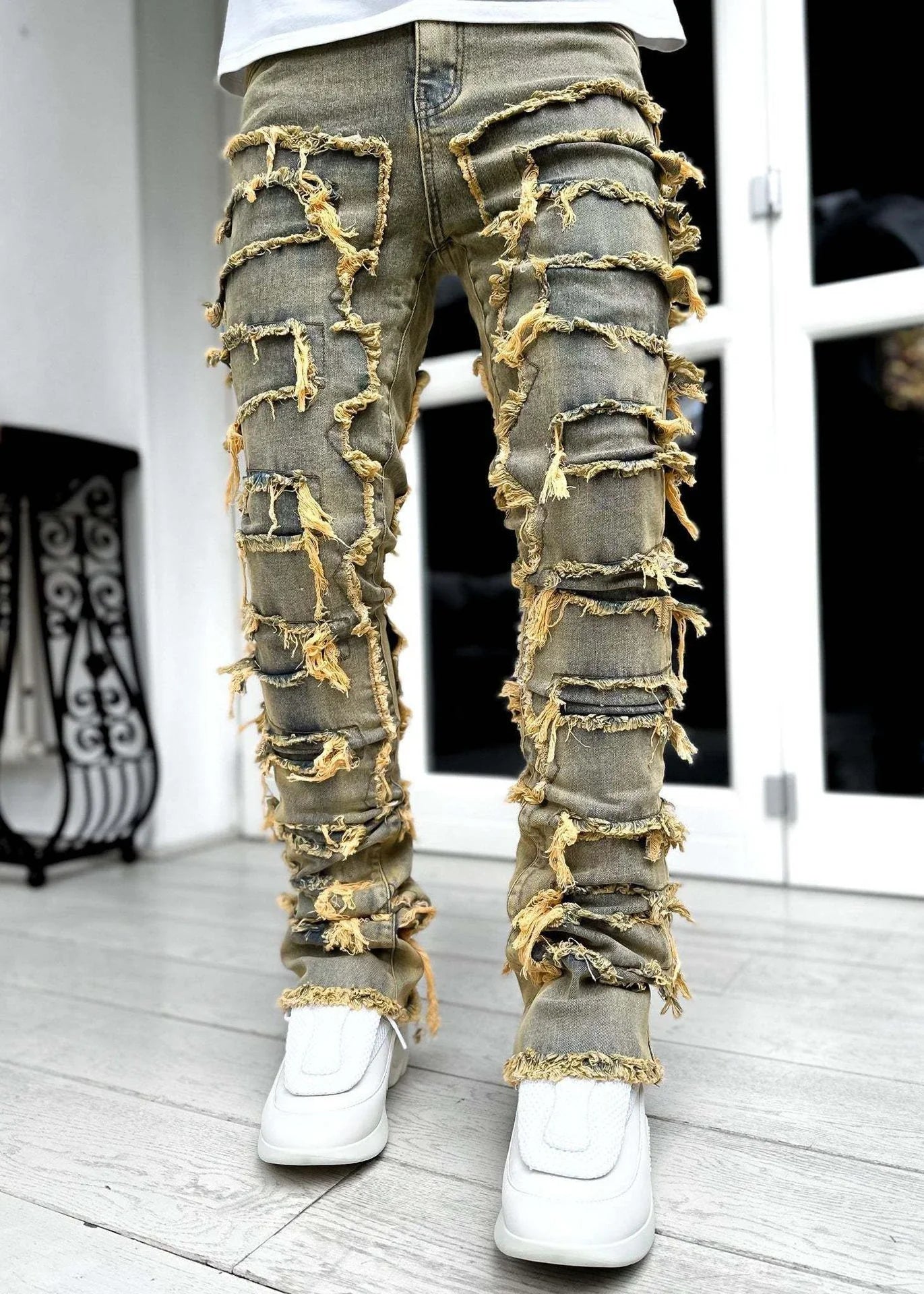 Stylish patched men's jeans with tight, stacked fit and variety of vibrant color options