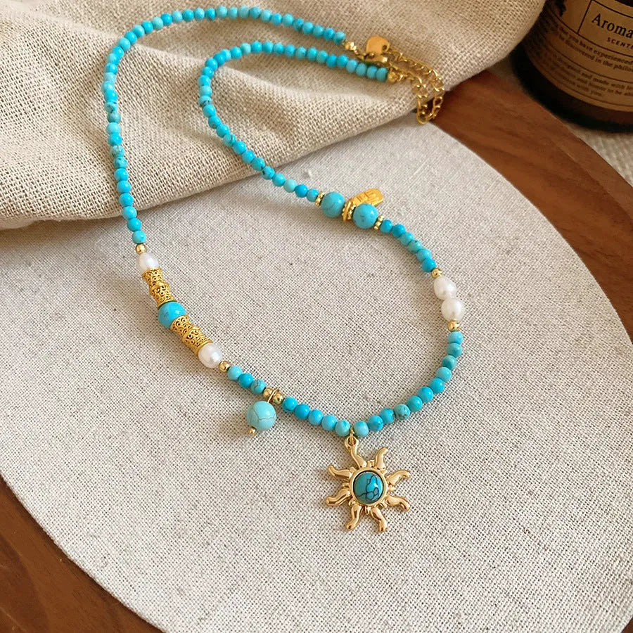 French court style freshwater pearl necklace with stone sun pendant on clavicle chain