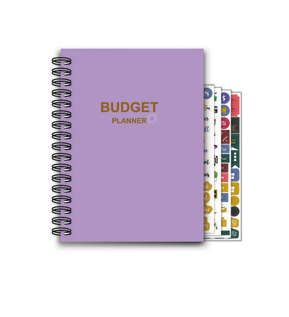 Purple A5 financial planning notebook with coil binding, showing monthly budget layout and included pen with stickers