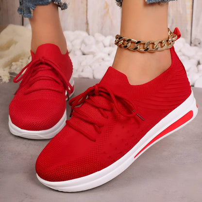 Women's casual fly-knit sneakers in round-toe design with lace-up closure