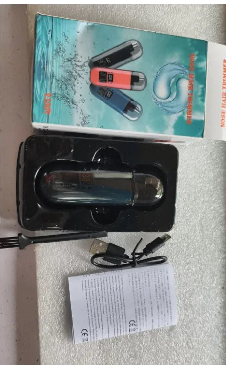 Rechargeable nose hair trimmer with digital display, removable cutter head, and cleaning brush.